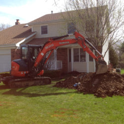 Foundation Drainage Project Excavating Contractors work around the existing basement foundation in Lake County, IL by Behm Enterprises