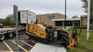 Sewer line installation at School in Mundelein, IL with Directional Drilling by Behm Enterprises. Site Utility contractor.