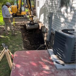Foundation Drainage Project excavation work around the existing basement foundation
